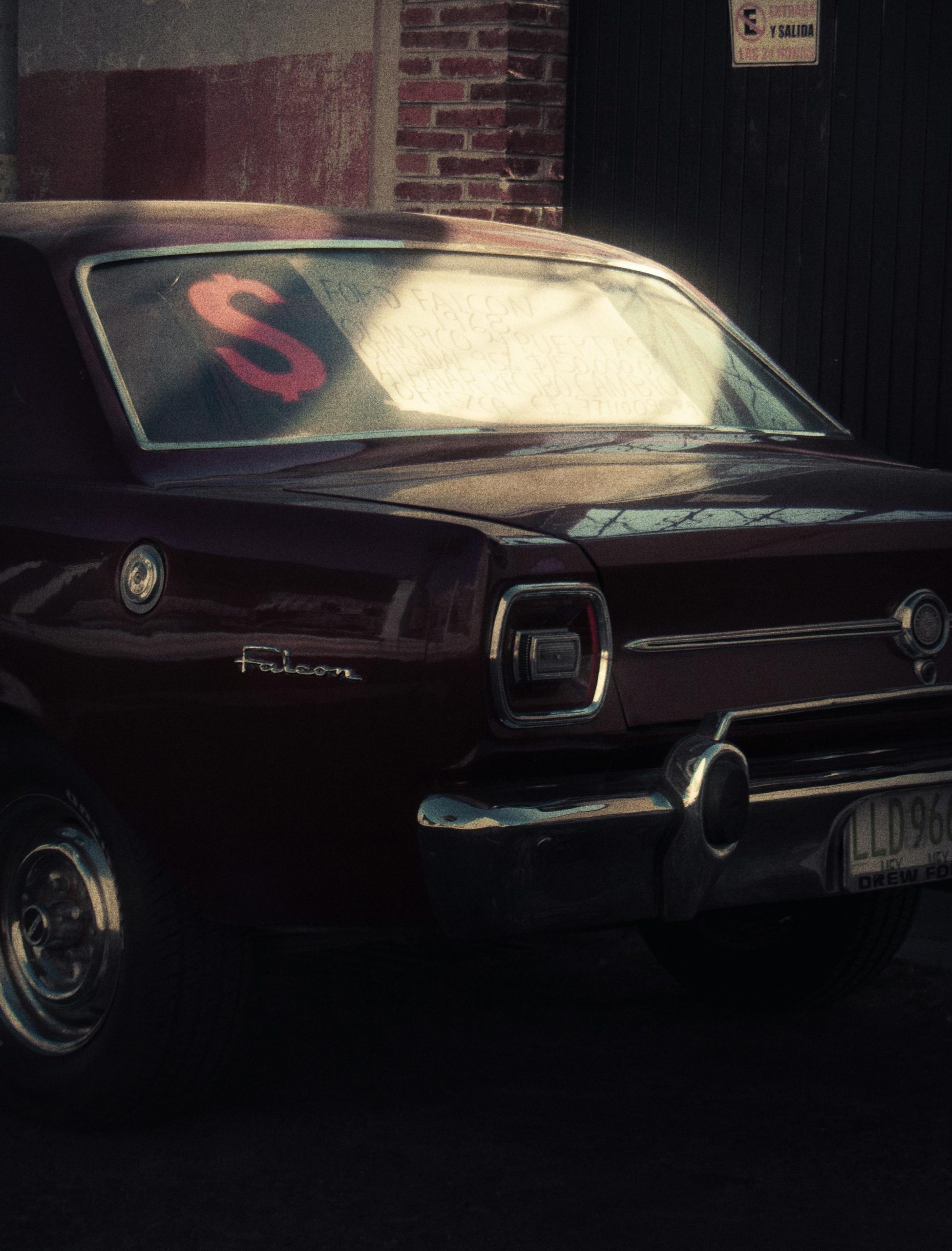 pexels photo 10992072 10992072 Rear view of a vintage maroon car with a for sale sign, parked outdoors.
